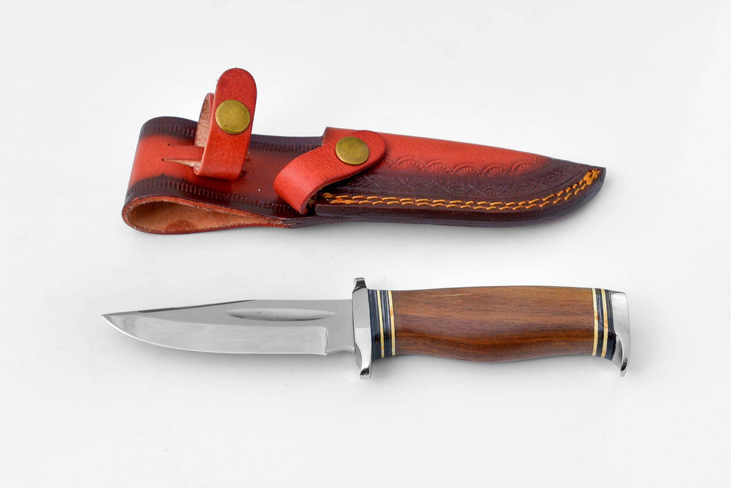 Knife with wooden handle and leather sheath on a white background