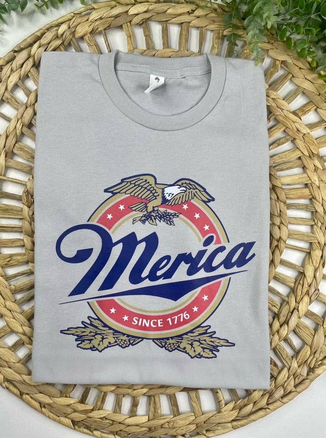Gray sweatshirt with 'Merica' graphic design on a woven mat