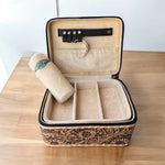Jewelry box with intricate designs on a wooden surface