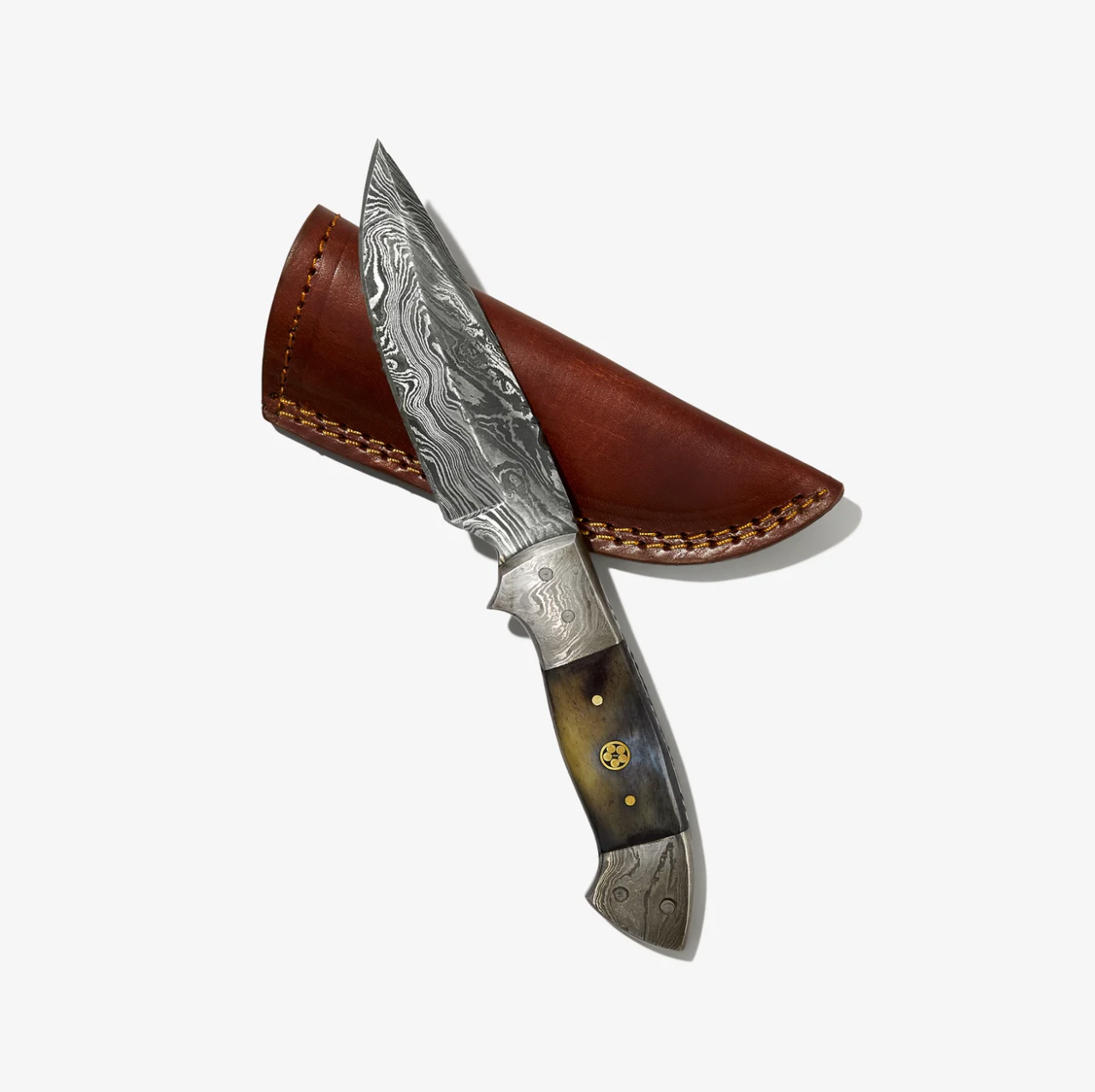 Decorative knife with a brown leather sheath on a white background