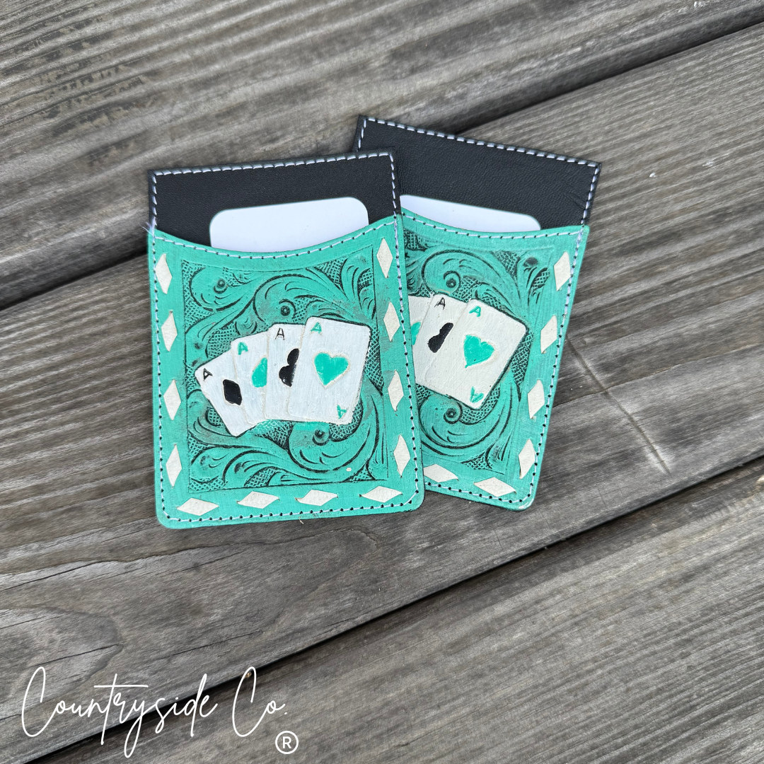 Turquoise card holders with playing card designs on a wooden surface, featuring the 'Countryside Co' brand.