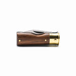 Wooden and gold object on a white background