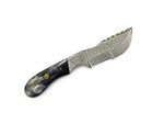 Decorative knife with a detailed blade and checkered handle on a white background