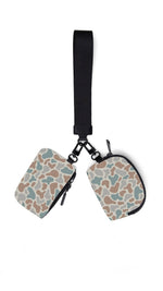 Two patterned pouches with a black strap on a white background