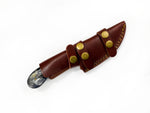 Decorative sheath with a pointed tip on a white background