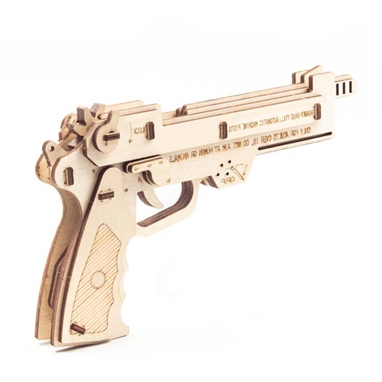 Wooden model of a gun on a white background
