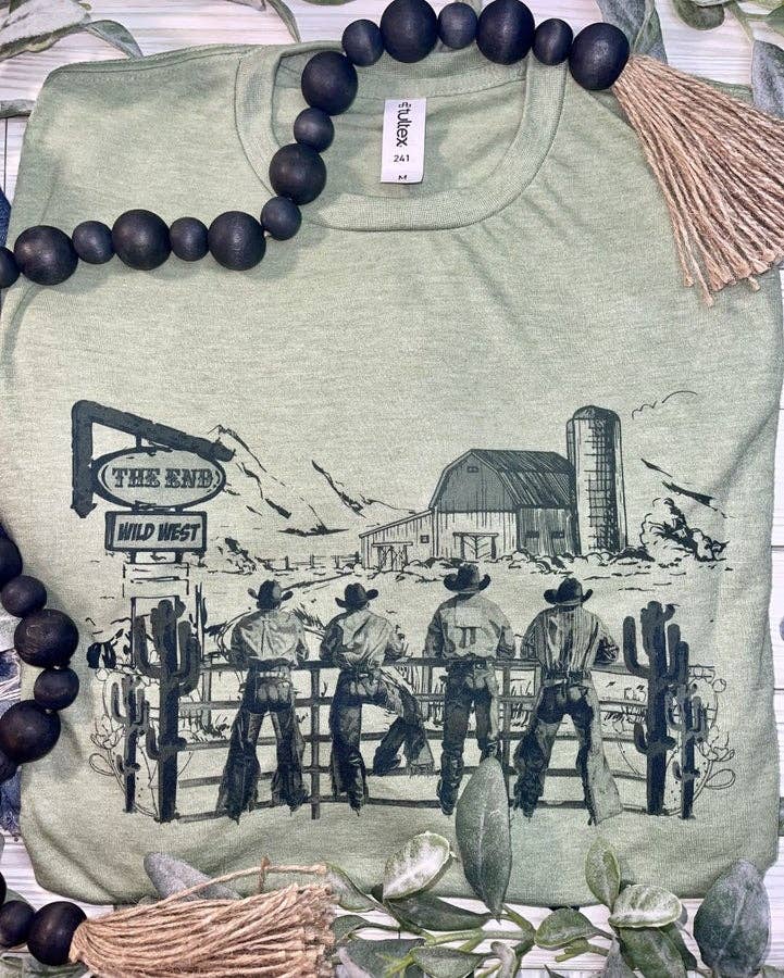 Green t-shirt with a graphic of cowboys and a barn, surrounded by decorative elements.