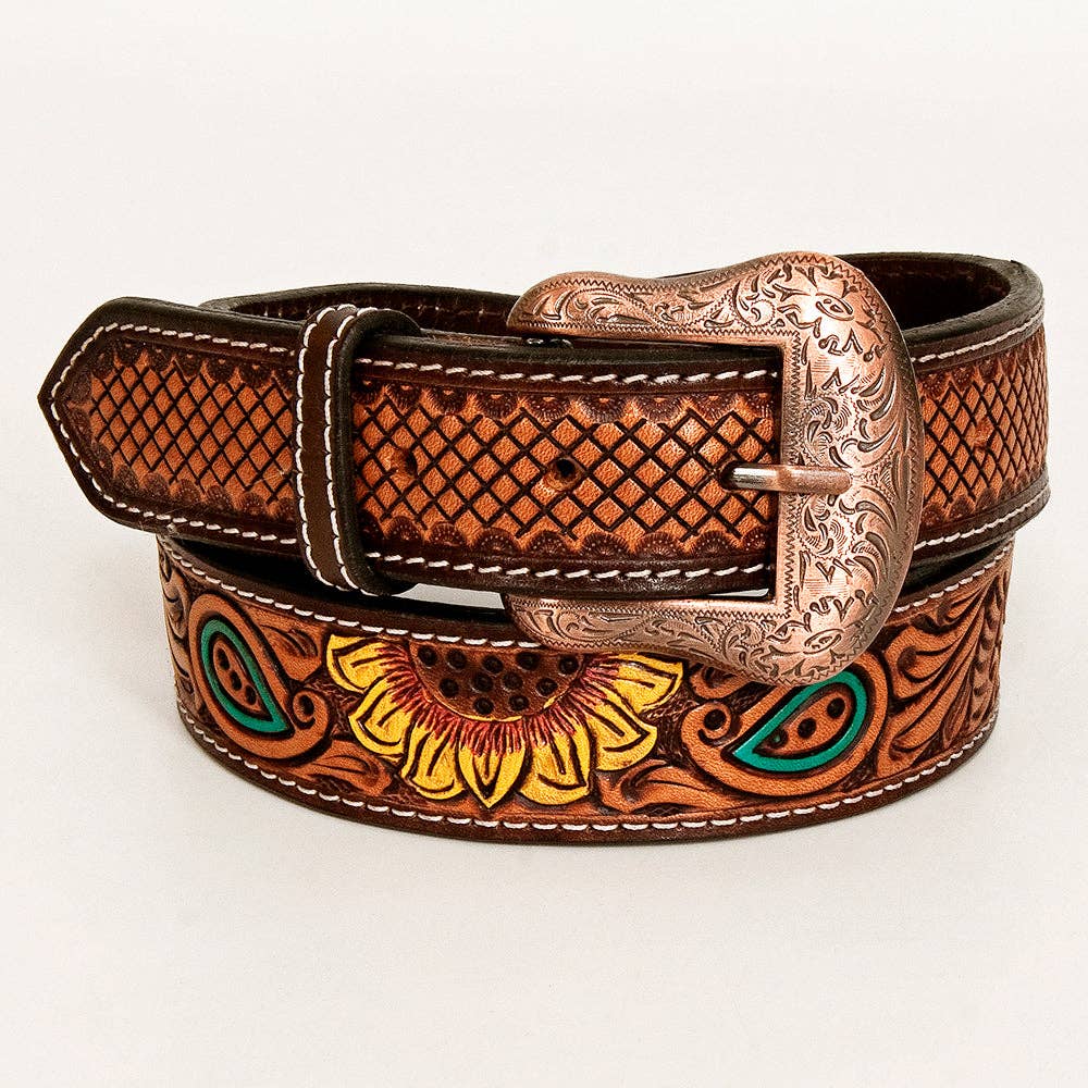 Brown leather belt with intricate designs and a decorative buckle on a white background