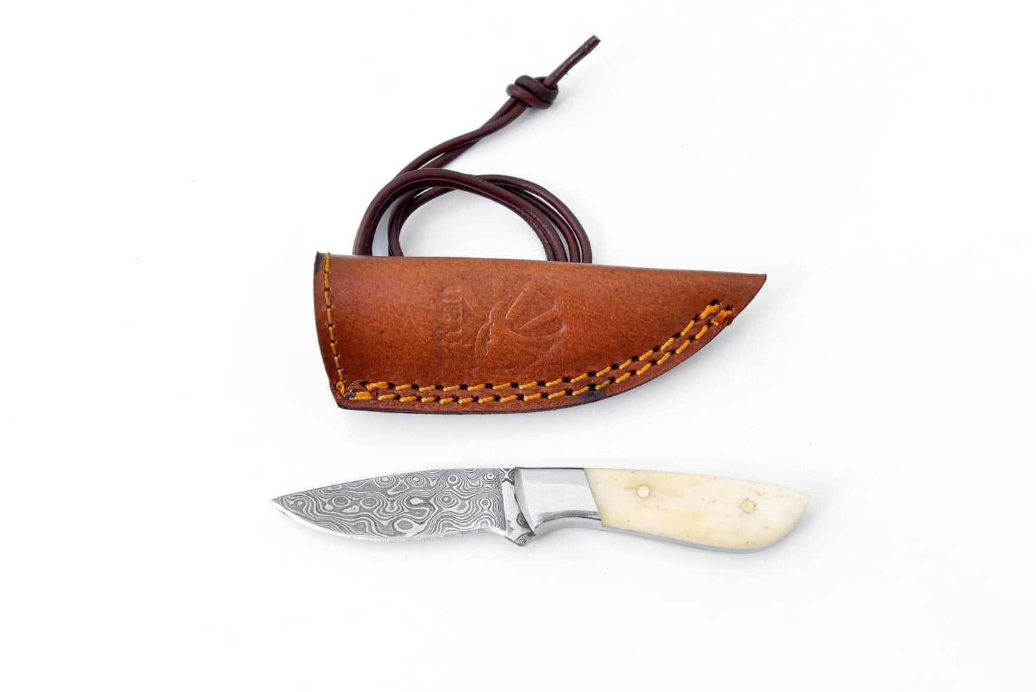 Knife with a brown leather sheath on a white background