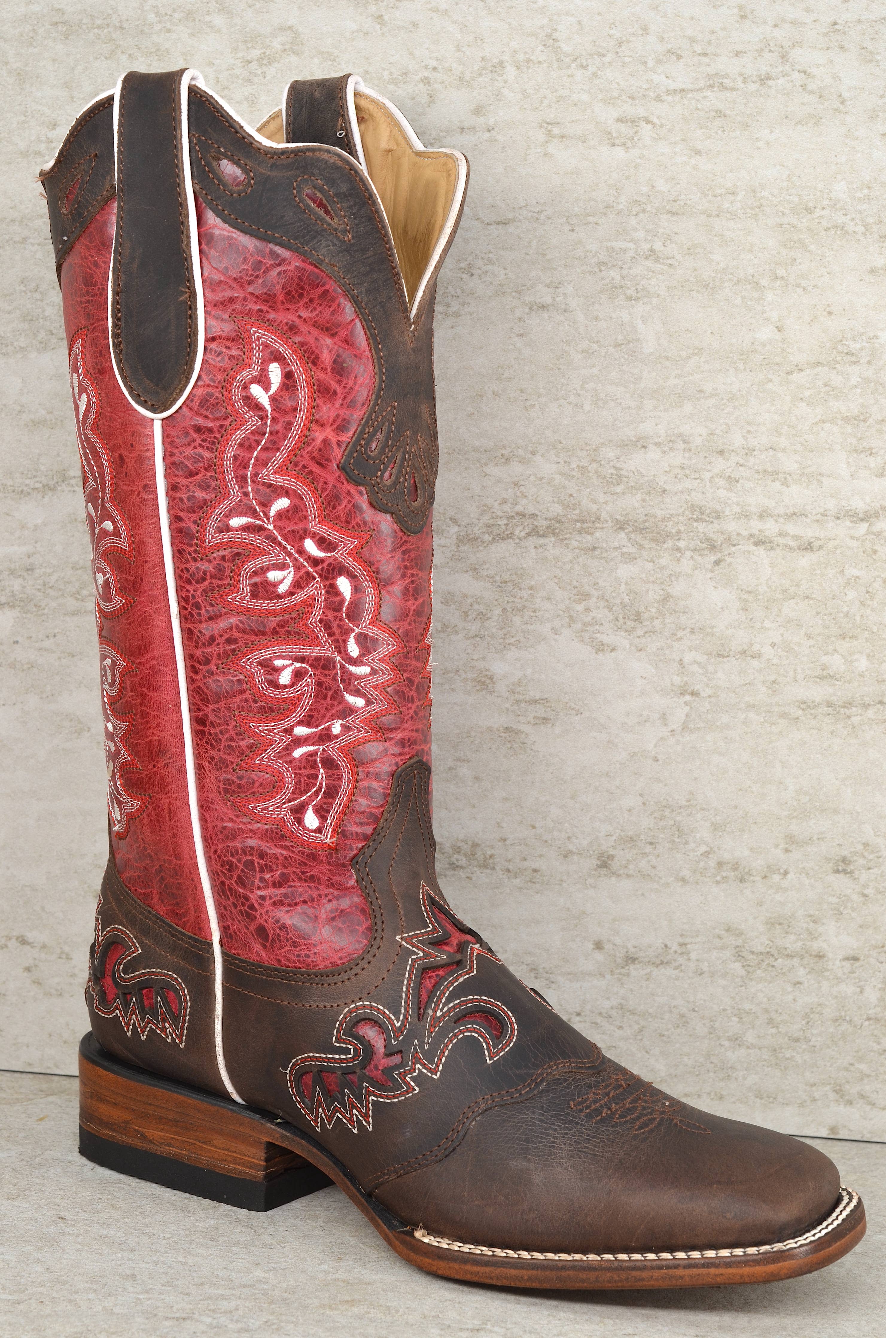 Brown and red cowboy boot on a textured gray background